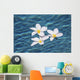 Plumeria flowers floating in clear blue water Wall Mural
