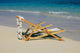 A lounge chair on the white sandy beach of Lanikai Wall Mural