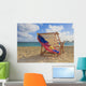 A lounge chair on the white sandy beach of Lanikai Wall Mural