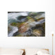 A close up of colorful river rocks under water Wall Mural