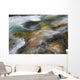 A close up of colorful river rocks under water Wall Mural
