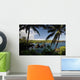 Hawaii, Maui, A sunny view of Waianapanapa from behind palm trees Wall Mural