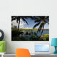 Hawaii, Maui, A sunny view of Waianapanapa from behind palm trees Wall Mural