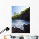 The rocky coastline of Waianapanapa showing the movement of the water Wall Mural