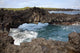 Hawaii, Maui, Hana, Lava rock formation arches over ocean Wall Mural