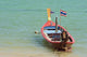 Close up of longtail boats along the in water Wall Mural