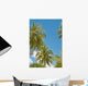 Thailand, Phuket, Vibrant palm trees and clear blue sky Wall Mural
