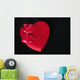 Valentines heart-shaped candy box against black background Wall Mural
