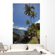 Palm trees and sunny blue sky on the Keanae coast Wall Mural