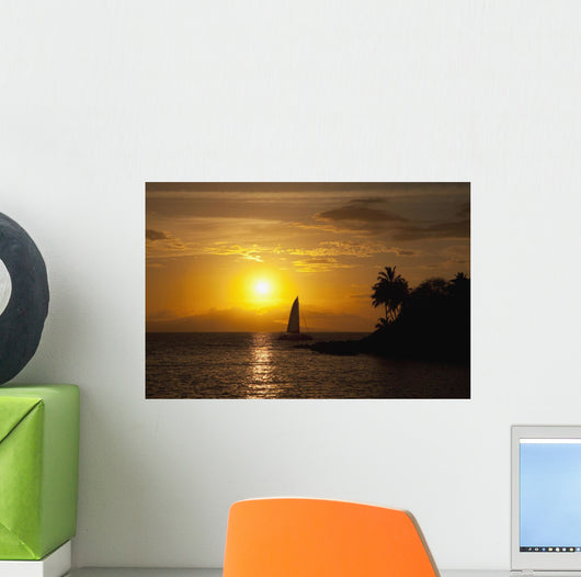 Hawaii, Maui, Makena, A silhouette of a sailboat at sunset Wall Mural