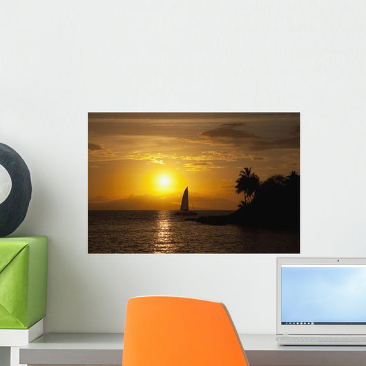 Hawaii, Maui, Makena, A silhouette of a sailboat at sunset Wall Mural