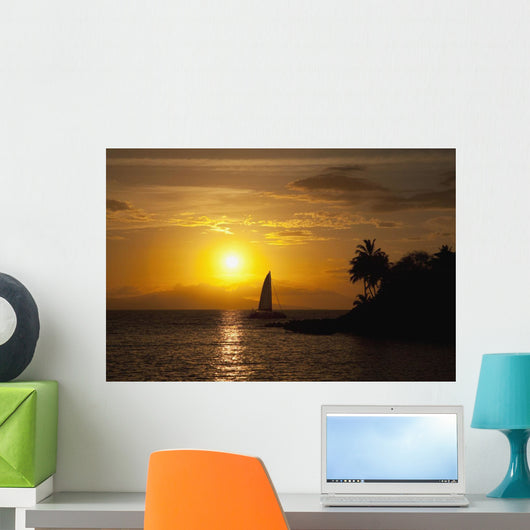 Hawaii, Maui, Makena, A silhouette of a sailboat at sunset Wall Mural