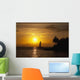 Hawaii, Maui, Makena, A silhouette of a sailboat at sunset Wall Mural