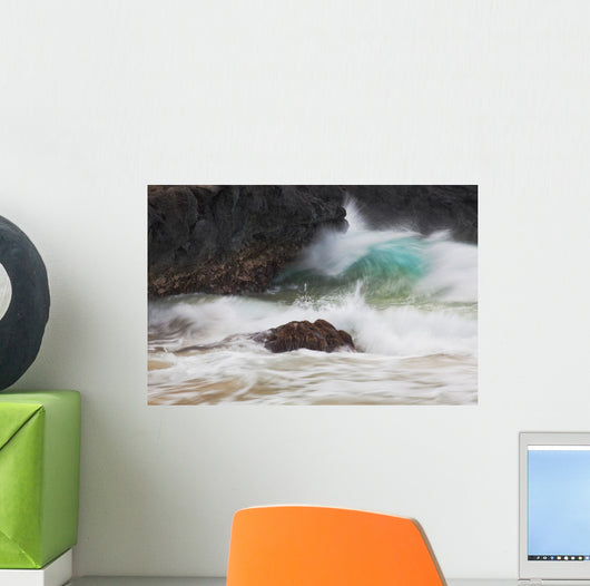Hawaii, Maui, Makena, An ocean wave crashes among a lava coast Wall Mural