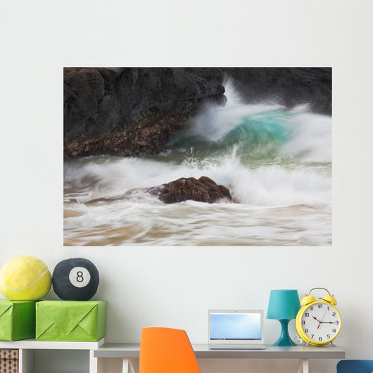 Hawaii, Maui, Makena, An ocean wave crashes among a lava coast Wall Mural