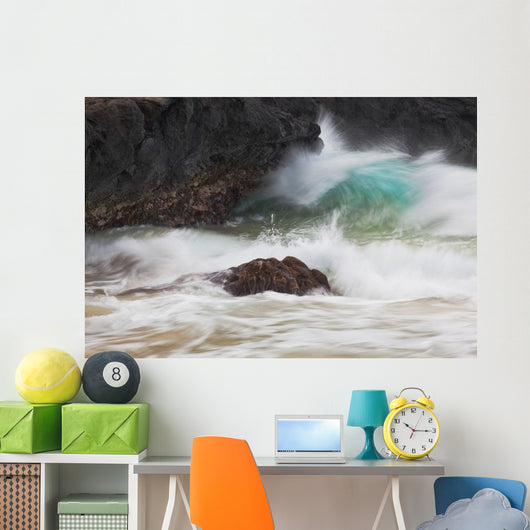 Hawaii, Maui, Makena, An ocean wave crashes among a lava coast Wall Mural