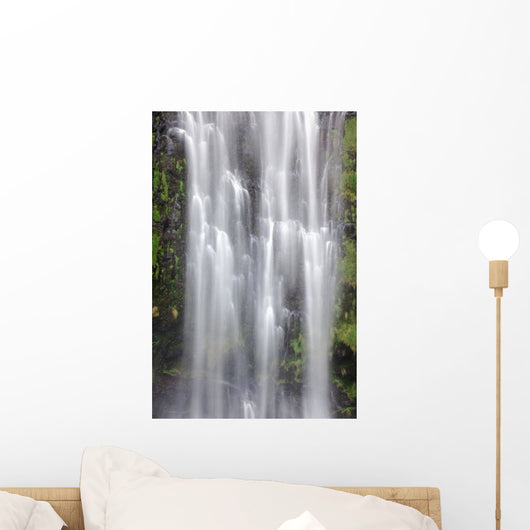 Hawaii, Maui, A waterfall in Kipahulu with lush foliage Wall Mural
