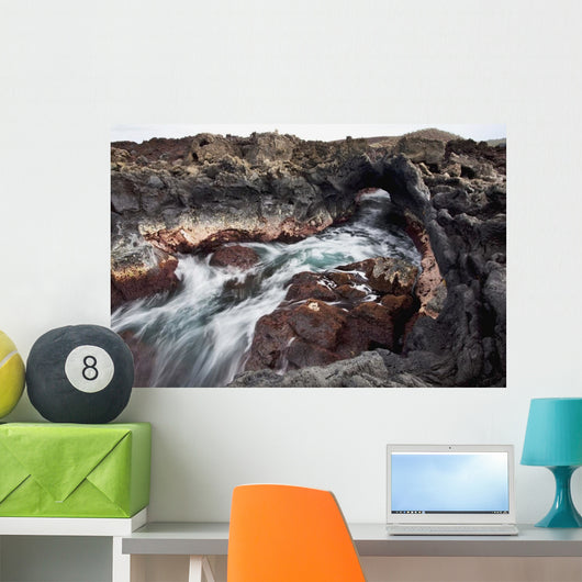 Hawaii, Maui, Makena, Ocean water moving through a lava tube Wall Mural