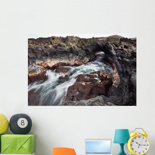 Hawaii, Maui, Makena, Ocean water moving through a lava tube Wall Mural