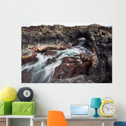 Hawaii, Maui, Makena, Ocean water moving through a lava tube Wall Mural