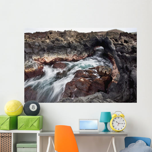 Hawaii, Maui, Makena, Ocean water moving through a lava tube Wall Mural