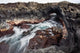 Hawaii, Maui, Makena, Ocean water moving through a lava tube Wall Mural