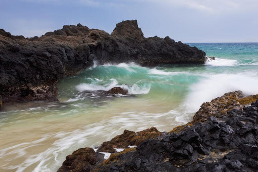 Hawaii, Maui, Makena, Ocean wave on rocky coastline Wall Mural