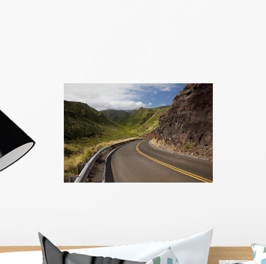 A winding road through Maui's west side with lush mountains Wall Mural
