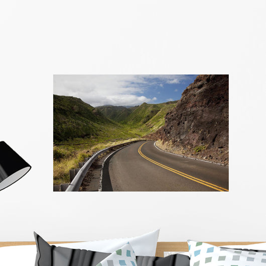 A winding road through Maui's west side with lush mountains Wall Mural