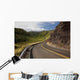 A winding road through Maui's west side with lush mountains Wall Mural