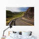 A winding road through Maui's west side with lush mountains Wall Mural