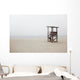 Abandoned lifeguard station on beach Wall Mural