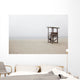 Abandoned lifeguard station on beach Wall Mural