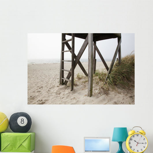 Close up of an abandoned lifeguard station on beach Wall Mural