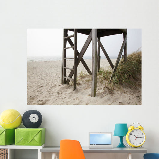 Close up of an abandoned lifeguard station on beach Wall Mural