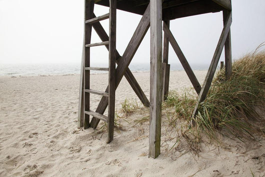 Close up of an abandoned lifeguard station on beach Wall Mural