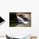 A forest riverbed and waterfall Wall Mural