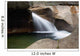 A forest riverbed and waterfall Wall Mural