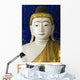 Head of a Buddha statue against blue background Wall Mural
