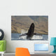Propelling its body from the ocean Wall Mural