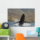 Propelling its body from the ocean Wall Mural