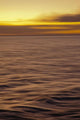 Hawaii, Maui, Ocean waves in motion and a vibrant tropical sunset Wall Mural