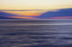 Hawaii, Maui, Ocean waves in motion and a vibrant tropical sunset Wall Mural