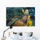 Hawaii, A green sea turtle being cleaned by yellow tangs Wall Mural