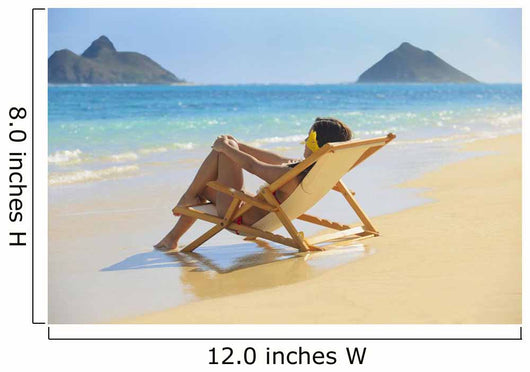 Beautiful woman lounges on a remote beach Wall Mural