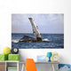 Hawaii, Humpback whale raises its pectoral fin above the surface Wall Mural