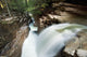 A forest waterfall Wall Mural