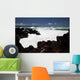 A wave breaks with lave rocks in the foreground Wall Mural