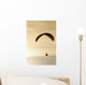 Paraglider flying in front of vibrant sunset EDITORIAL USE ONLY Wall Mural