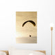 Paraglider flying in front of vibrant sunset EDITORIAL USE ONLY Wall Mural